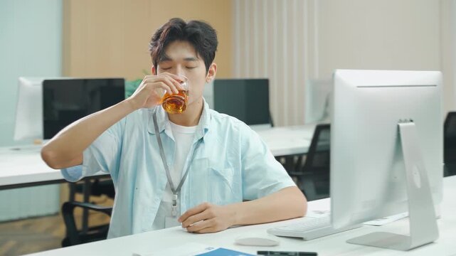 Businessman office worker man on workplace feel sick with a cold or flu symptoms works on a laptop, male employee taking cold medicine feeling unhealthy ill. Seasonal allergy. Health problem concept.
