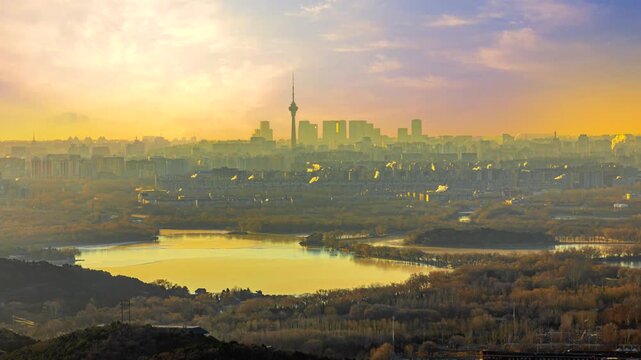 Beijing Skyline at Sunrise with Lake and Central Radio and Television Tower in Beijing, China