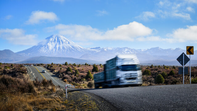 High speed truck travelling on Desert Road. Mount Ngauruhoe in the distance. State Highway 1. North Island.