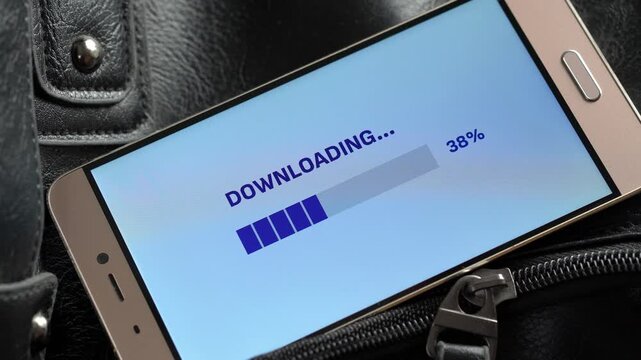 Smartphone displays downloading progress bar.