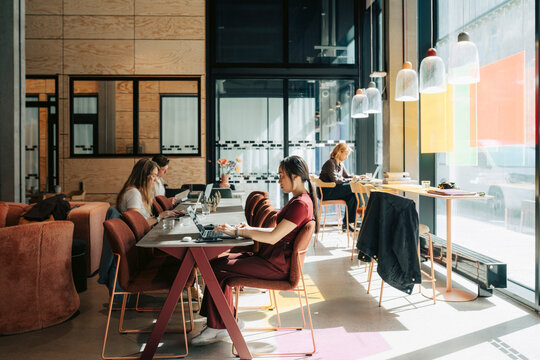 Diverse professionals working in collaborative open-plan office