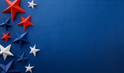 Festive arrangement of red, white and blue paper stars and curled ribbons on dark blue background. Patriotic border with empty space for text, suitable for Independence, Fourth of July, Memorial © kasia2003