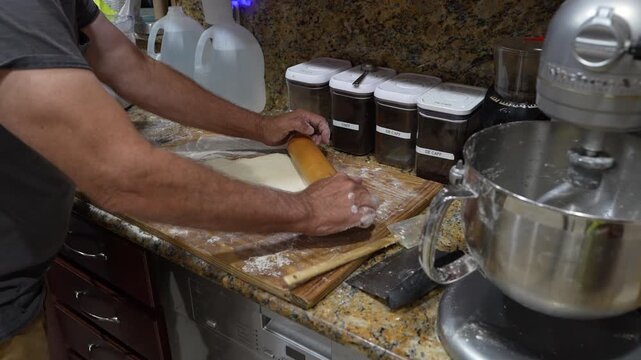Hands Rolling Dough for Homemade Bread