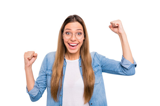 Close up photo of excited cheerful full of good emotion teen lady raising gesturing fists up isolated grey background