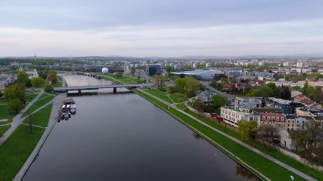 Aerial flyover over the Vistula River in Krakow at dawn in spring