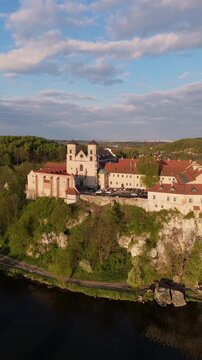 Aerial flyover of Tyniec Abbey in Poland at sunset in spring