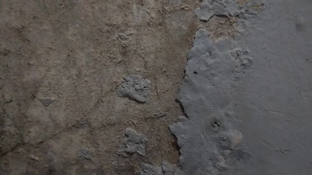 Wall paint is peeling and damaged due to damp walls and water seepage