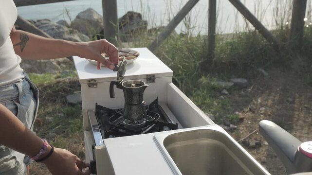 Moka pot coffee ready with steam, van life, Italy