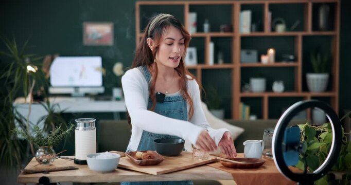 Matcha, live stream and phone with woman in home for green tea tutorial, wellness influencer and review. Social media, content creation and health drink guide with person and ring light in house