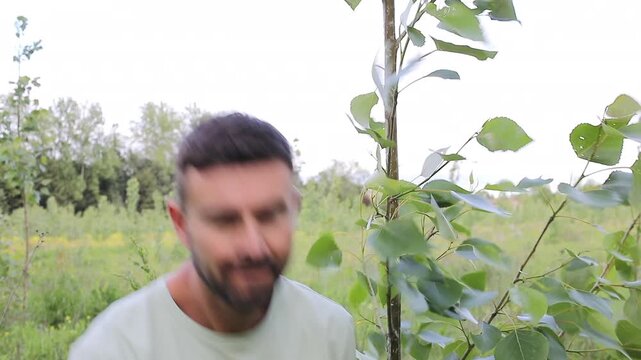 Landowner smiling next to Poplar Tree on His Plantation 