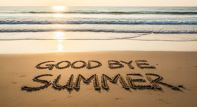 "GOOD BYE SUMMER" text on last day of vacation beach sand, seasonal farewell and holiday ending during golden hour