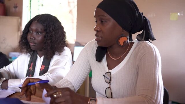 team of young african people sitting in office discussing and working, enterpreneurship in africa