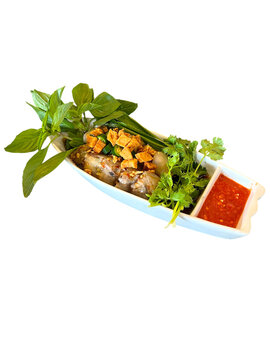 Thai fresh rice noodle rolls kuay teow lui suan with vegetables and chili dipping sauce healthy street food close up