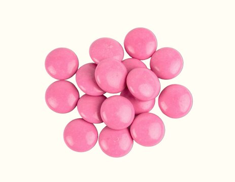 Small Pile of Premium Pink Ruby Chocolate Callets Expertly Isolated Over a Plain White Background