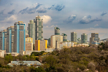 Naklejka premium Pyongyang city view from Arch of Triumph. Cherry blossoms. Ryomyong St, Moranbong St, Sungri St, Kaeson subway, Kaeson Cinema, unfinished Ryugyong Hotel.
