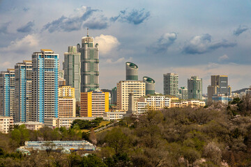 Obraz premium Pyongyang city view from Arch of Triumph. Cherry blossoms. Ryomyong St, Moranbong St, Sungri St, Kaeson subway, Kaeson Cinema, unfinished Ryugyong Hotel.