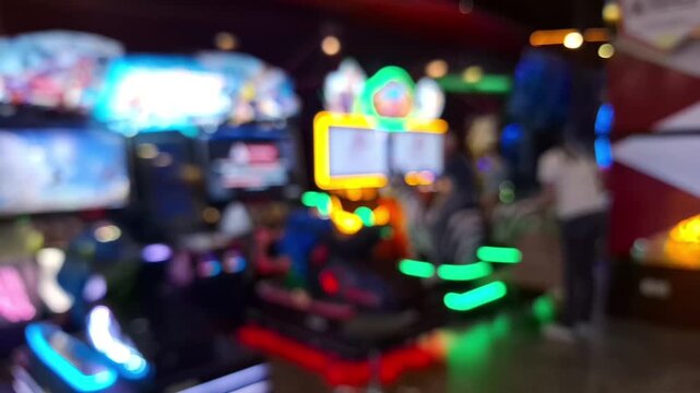 Blurred colorful neon lights in an arcade center.