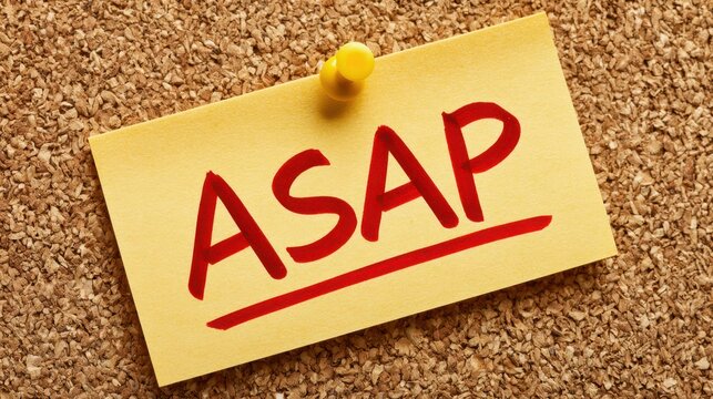 Close-up of yellow sticky note pinned to corkboard with bold red 'ASAP' reminder conveying urgent office deadline