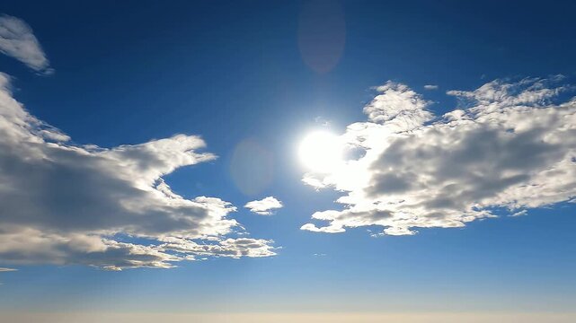 Bright sun and white clouds in blue sky for weather background