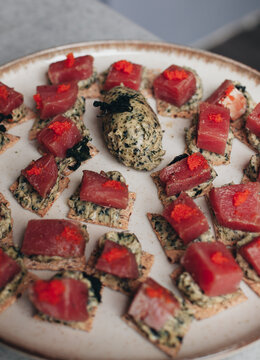 canap&eacute;s on a plate with tuna