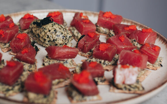 canap&eacute;s on a plate with tuna