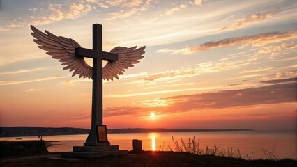 Naklejka premium Sunset over a waterfront with a large cross sculpture featuring angel wings, creating a serene and spiritual atmosphere.