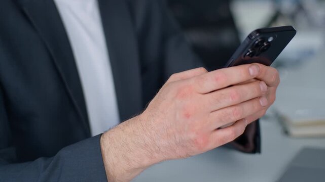 Close up male hands holding mobile phone unrecognizable business man texting message e-mail with app distant communicate chatting smartphone unrecognizable businessman working with telephone in office