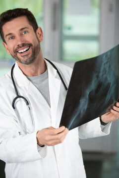 a happy doctor checking xray