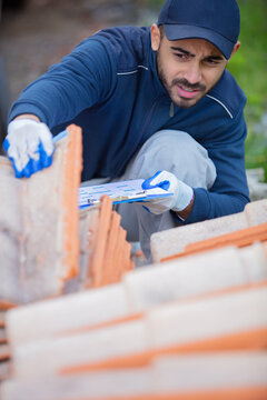 young happy man tiling on rooftop