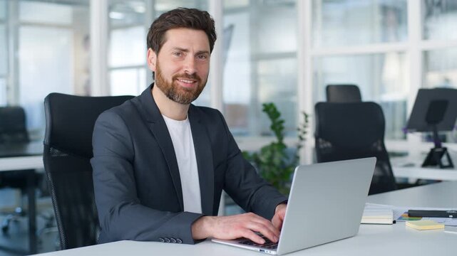 Startup owner Caucasian middle-aged business man working laptop smiling toothy happy smile looking at camera mature businessman male company CEO leader lawyer work typing computer service in office