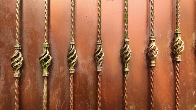 decorative wrought iron fence balusters featuring a twisted design and forged basket element