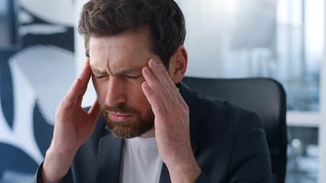 Pensive ill sick upset Caucasian middle-aged business man feeling headache touching painful head bad unhealthy male mature businessman feel migraine tension pressure pain medicine trouble in office