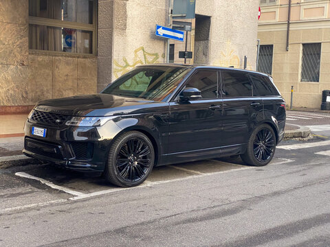 Land Rover Range Rover Sport SVR black luxury SUV parked on a city street, showcasing performance and urban style
