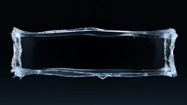 Slow motion static shot of rectangular ice frame cracking and fragmenting into shards on dark studio stage with black background and reflective glossy surface