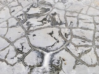 Cracked grunge concrete cement walls, building damage due to natural factors and age, walls need renovation, texture of cracks similar to fish scales © Sigit
