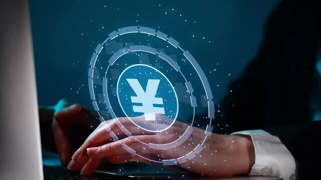 Hand using laptop with digital yen symbol representing online financial activity in an office setting