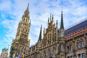 Obraz premium Detailed view of the New Town Hall facade and clock tower in Munich. Concept of Gothic revival architecture, heritage preservation and European history