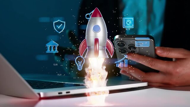 Rocket launching from a laptop while a person holds a smartphone in a technology setting during a digital concept event