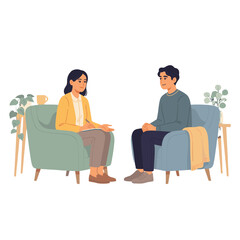 Obraz premium A therapist listens attentively to a patient seated in a comfortable armchair.