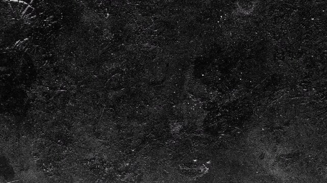 Abstract dark black textured background with subtle surface imperfections and grunge details.