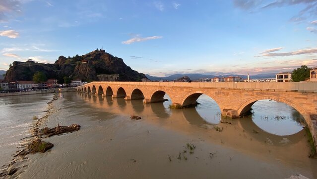 Historic Koyunbaba Bridge spanning the Kızılırmak River in Osmancık, &Ccedil;orum, T&uuml;rkiye. This magnificent 15th-century Ottoman stone arch bridge, built during the reign of Sultan Bayezid II, stands as one