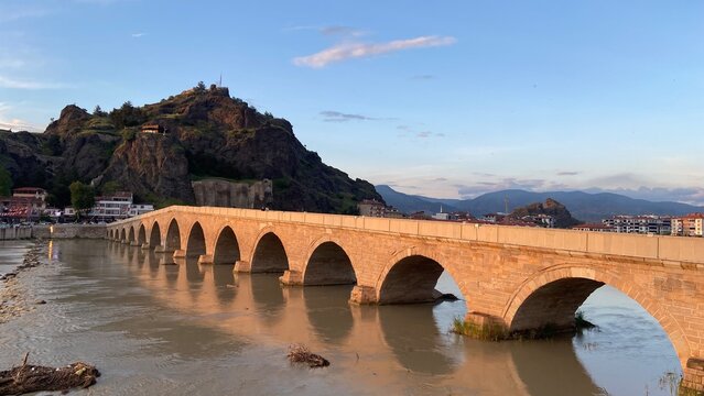 Historic Koyunbaba Bridge spanning the Kızılırmak River in Osmancık, &Ccedil;orum, T&uuml;rkiye. This magnificent 15th-century Ottoman stone arch bridge, built during the reign of Sultan Bayezid II, stands as one