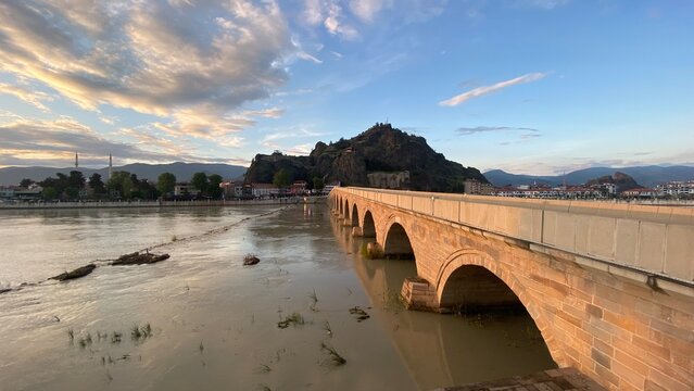 Historic Koyunbaba Bridge spanning the Kızılırmak River in Osmancık, &Ccedil;orum, T&uuml;rkiye. This magnificent 15th-century Ottoman stone arch bridge, built during the reign of Sultan Bayezid II, stands as one