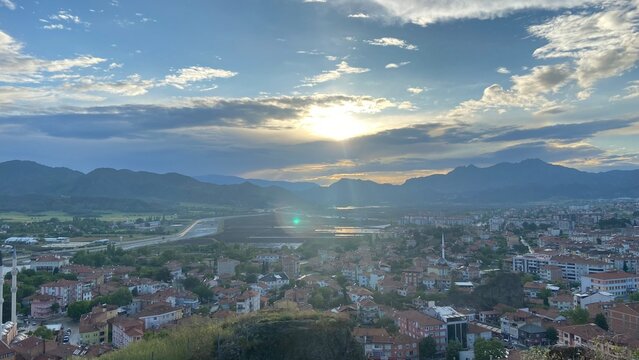 Panoramic view from Osmancık Castle overlooking the historic Koyunbaba Bridge, the winding Kızılırmak River, and the town of Osmancık in &Ccedil;orum, T&uuml;rkiye. This breathtaking landscape combines centuries 