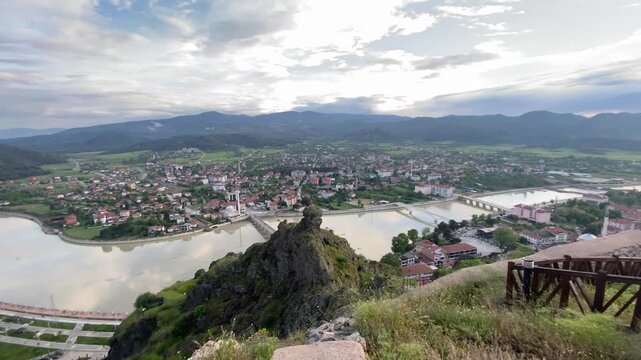 Panoramic view from Osmancık Castle overlooking the historic Koyunbaba Bridge, the winding Kızılırmak River, and the town of Osmancık in &Ccedil;orum, T&uuml;rkiye. This breathtaking landscape combines centuries 