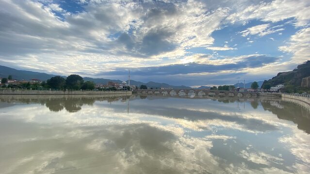 Panoramic view from Osmancık Castle overlooking the historic Koyunbaba Bridge, the winding Kızılırmak River, and the town of Osmancık in &Ccedil;orum, T&uuml;rkiye. This breathtaking landscape combines centuries 