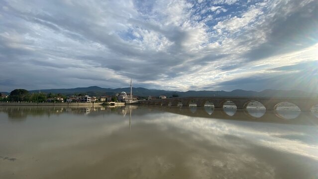 Historic Koyunbaba Bridge spanning the Kızılırmak River in Osmancık, &Ccedil;orum, T&uuml;rkiye. This magnificent 15th-century Ottoman stone arch bridge, built during the reign of Sultan Bayezid II, stands as one