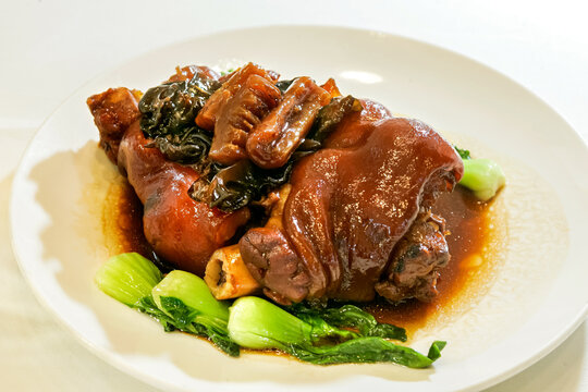 Braised pork hock with bok choy and mushrooms