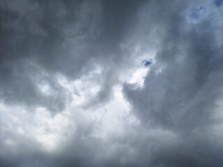 Obraz premium Dark storm clouds rolling across the sky before heavy rain.
