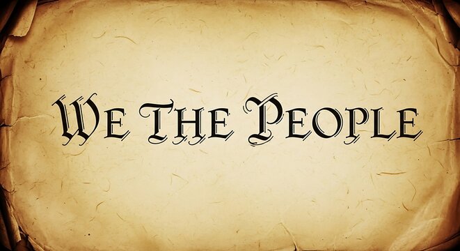 Vintage parchment with the iconic phrase we the people in elegant calligraphy font on distressed paper background texture